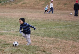 Michael working on his dribbling technique.  He loved kicking and chasing after the ball. 