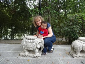 Max and Mom posing by one of the animals usually used to protect the Temple (not sure if that is really the case here)