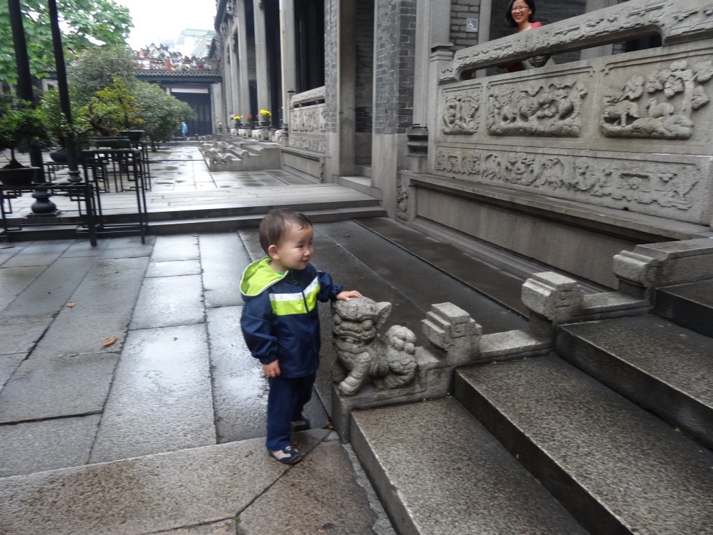 Max posing with one of the cub lions who was taking pride in guarding the steps inside the temple. 